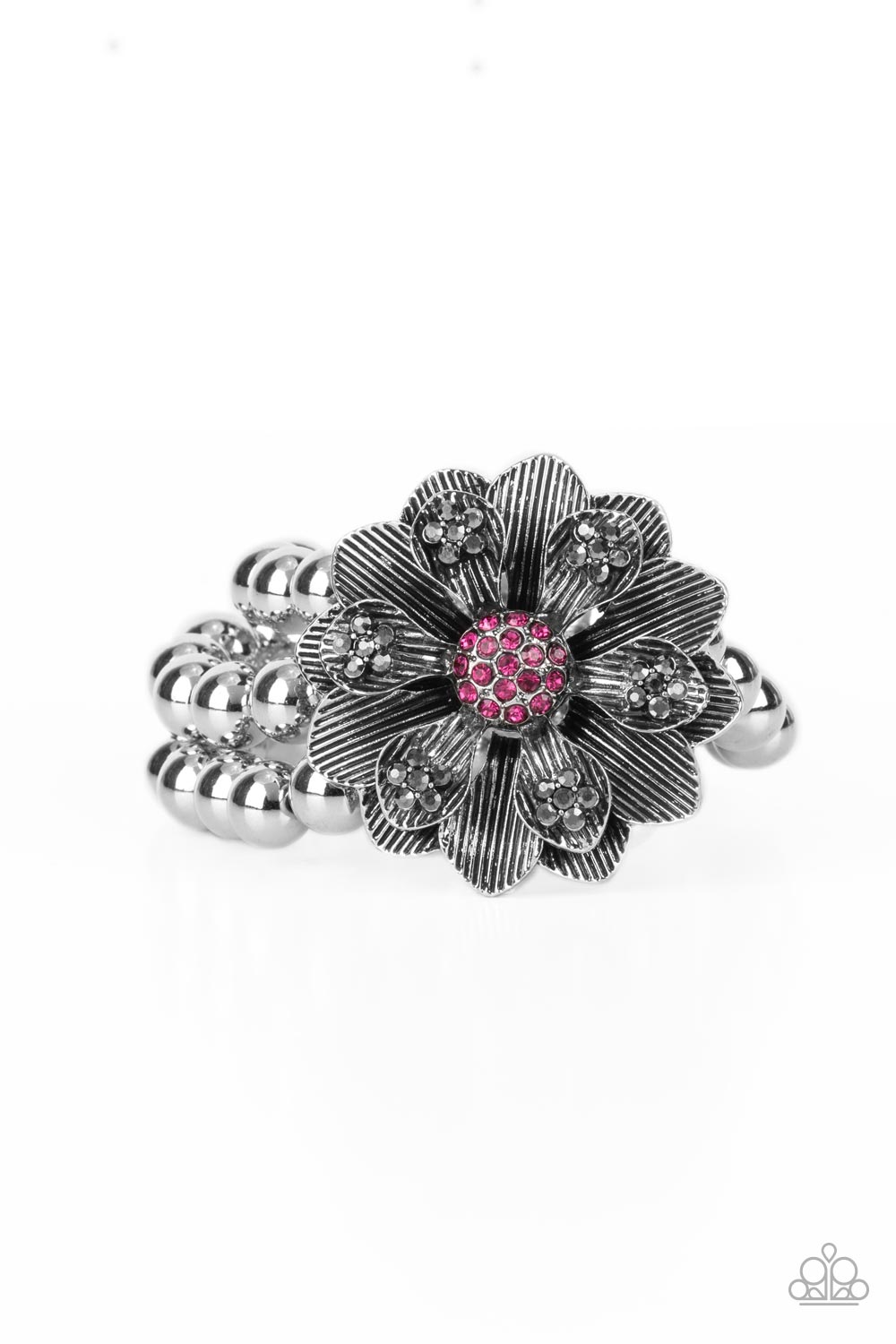 Botanical Bravado Pink Bracelet - Paparazzi Accessories  A daring oversized silver flower is composed of petals lined in antiqued silver and dotted with smoky hematite rhinestones. A sphere of dainty Fuchsia Fedora rhinestones creates the center of the flower as it sits atop a trio of shiny silver beaded stretchy bands around the wrist for a dramatically whimsical look.  Sold as one individual bracelet.