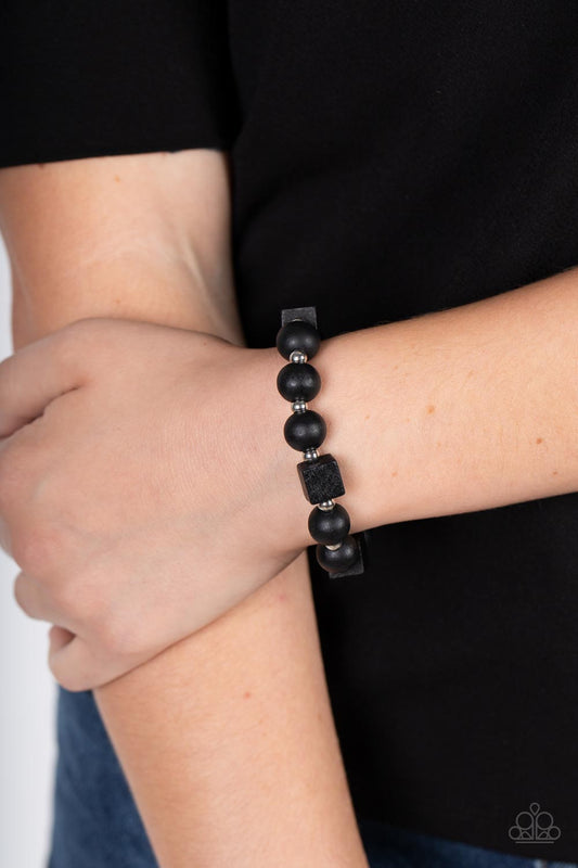 Timber Trendsetter Black Urban Bracelet - Paparazzi Accessories  Infused with dainty silver beads, an earthy collection of round and cube black wooden beads are threaded along a stretchy band around the wrist for a natural look.  Sold as one individual bracelet.