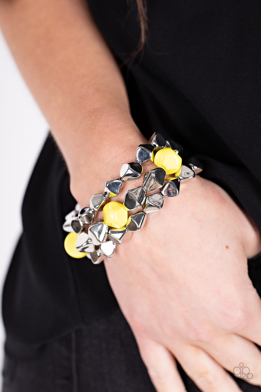A Perfect TENACIOUS Yellow Bracelet - Paparazzi Accessories  Infused with pops of Illuminating accents, a faceted series of silver beads are threaded along stretchy bands around the wrist for a flashy fashion.  Sold as one set of three bracelets.
