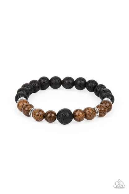 Neutral Zone Brown Bracelet - Paparazzi Accessories  Infused with dainty silver accents, an earthy compilation of brown wooden beads and black lava stone beads are threaded along stretchy bands around the wrist for an urban flair.  Sold as one individual bracelet.