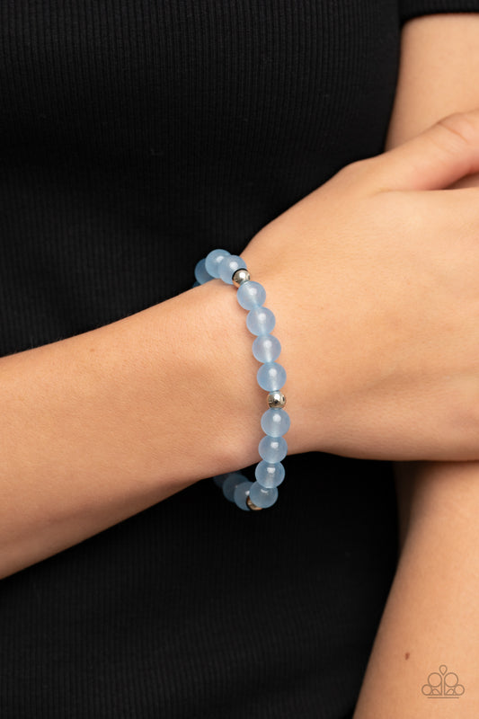 Forever and a DAYDREAM Blue Bracelet - Paparazzi Accessories  Infused with silver accents, a glassy collection of opaque blue beads are threaded along a stretchy band around the wrist for a dreamy glow.  Sold as one individual bracelet.