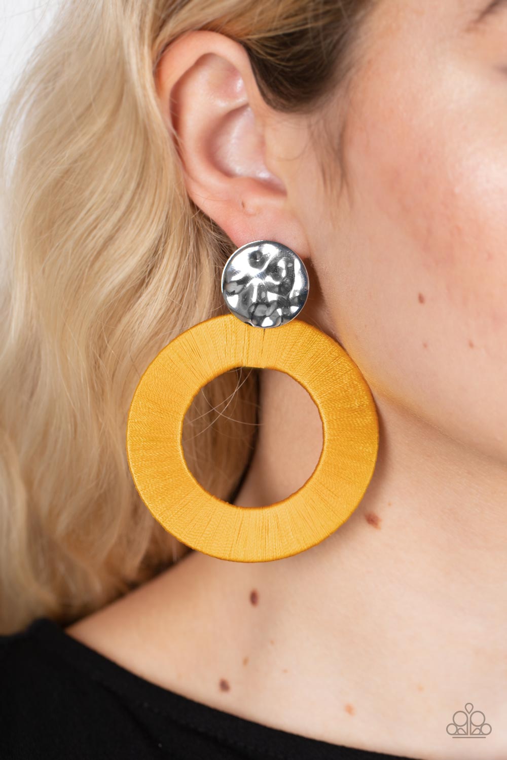 Strategically Sassy Yellow Post Earring - Paparazzi Accessories  A hammered silver disc gives way to an oversized metal hoop wrapped in golden yellow thread, resulting in a modern lure. Earring attaches to a standard post fitting.  Sold as one pair of post earrings.
