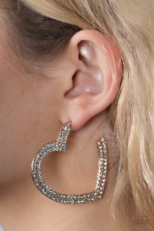 AMORE to Love Gold Hoop Earring - Paparazzi Accessories  Two rows of blinding white rhinestones are encrusted along the front of a heart shaped gold hoop, creating heart-stopping sparkle. Hoop measures approximately 2" in diameter. Earring attaches to a standard post fitting.  Sold as one pair of hoop earrings.