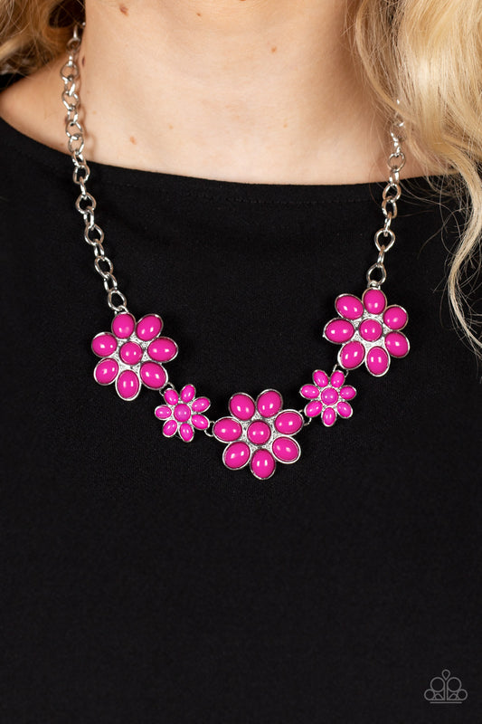 Flamboyantly Flowering Pink Necklace - Paparazzi Accessories  A flirtatious collection of Fuchsia Fedora dotted floral frames alternate with dainty opaque Fuchsia Fedora flowers below the collar, creating a vivacious pop of color. Features an adjustable clasp closure.  Sold as one individual necklace. Includes one pair of matching earrings.