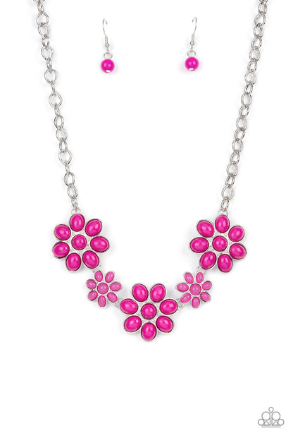 Flamboyantly Flowering Pink Necklace - Paparazzi Accessories  A flirtatious collection of Fuchsia Fedora dotted floral frames alternate with dainty opaque Fuchsia Fedora flowers below the collar, creating a vivacious pop of color. Features an adjustable clasp closure.  Sold as one individual necklace. Includes one pair of matching earrings.