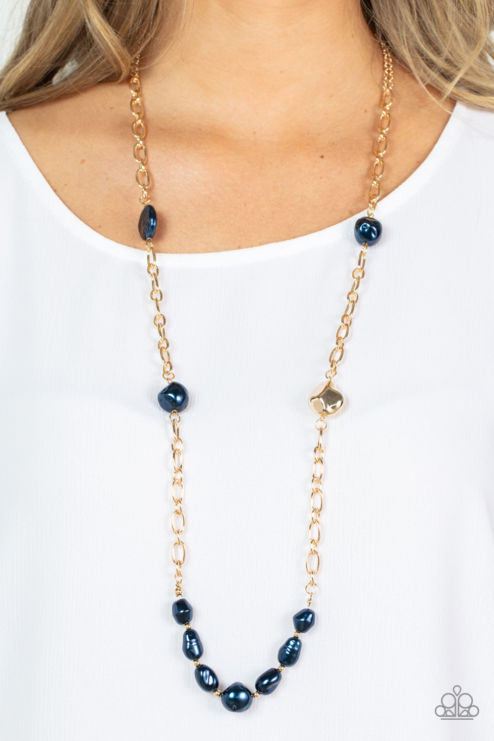 Pardon My FABULOUS - Blue Item #P2RE-BLXX-351XX Infused with dainty gold beads, an elegant collection of imperfect blue pearls and gold beads asymmetrically adorn a substantial gold chain across the chest for an effortless elegance. Features an adjustable clasp closure.  Sold as one individual necklace. Includes one pair of matching earrings.