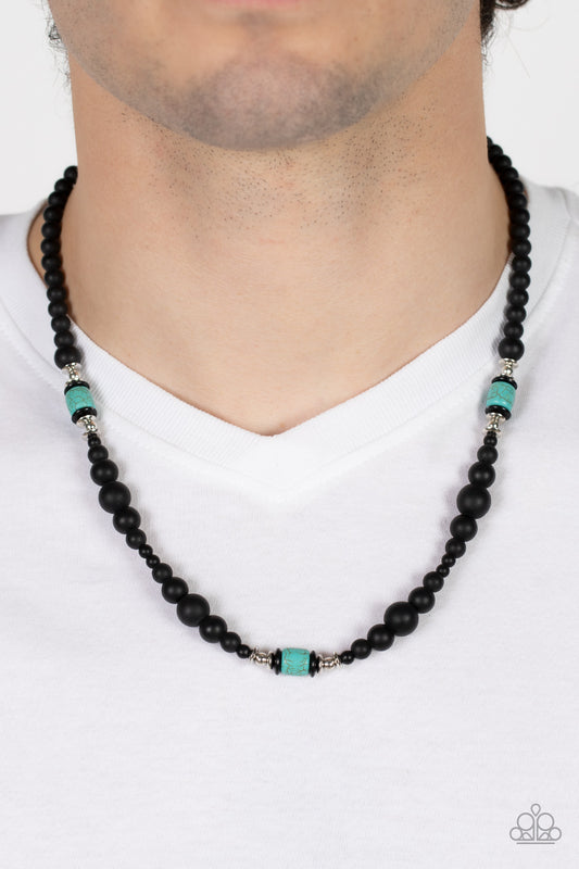 Stone Synchrony Blue Urban Necklace - Paparazzi Accessories  Grounding sections of dainty silver beads and turquoise stone accents adorn a strand of black stone beads, creating an earthy compliment below the collar. Features an adjustable clasp closure.  All Paparazzi Accessories are lead free and nickel free!  Sold as one individual necklace.