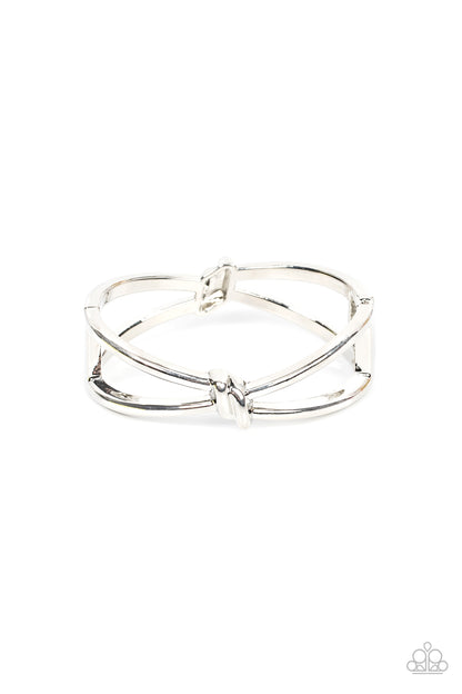 KNOT My First Rodeo Silver Bracelet - Paparazzi Accessories  Striking silver bars delicately knot at the top and bottom of the wrist, resulting in an edgy bangle-like bracelet. Features a hinged closure.  Sold as one individual bracelet.