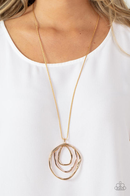 Revamped Relic - Gold Item #P2BA-GDXX-052XX A trio of mismatched warped gold and rose gold rings swing from the bottom of a glistening gold chain, creating an asymmetrically stacked pendant. Features an adjustable clasp closure.  Sold as one individual necklace. Includes one pair of matching earrings.