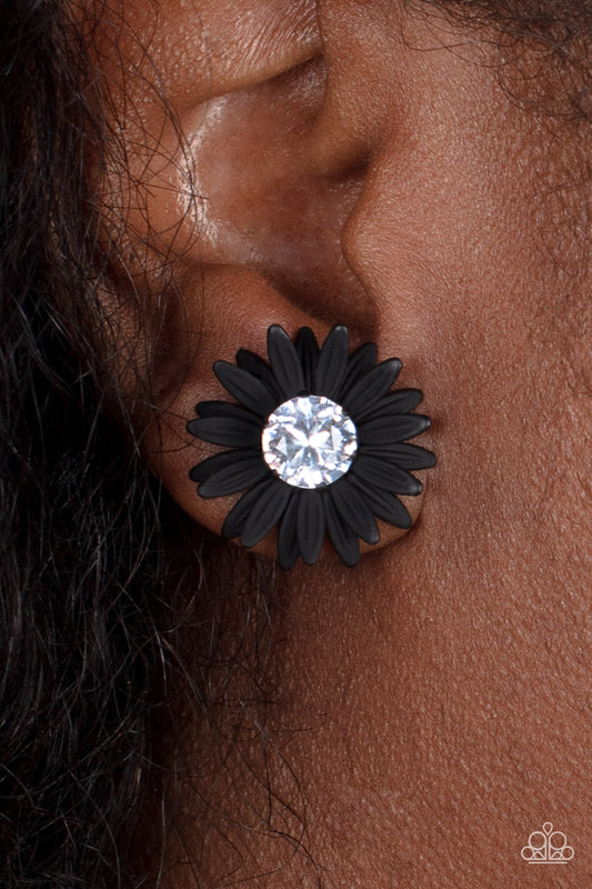 Sunshiny DAIS-y Black Post Earring - Paparazzi Accessories  Layers of black petals fan out from an oversized white rhinestone fitting, blooming into a sparkly floral centerpiece. Earring attaches to a standard post fitting.  Sold as one pair of post earrings.