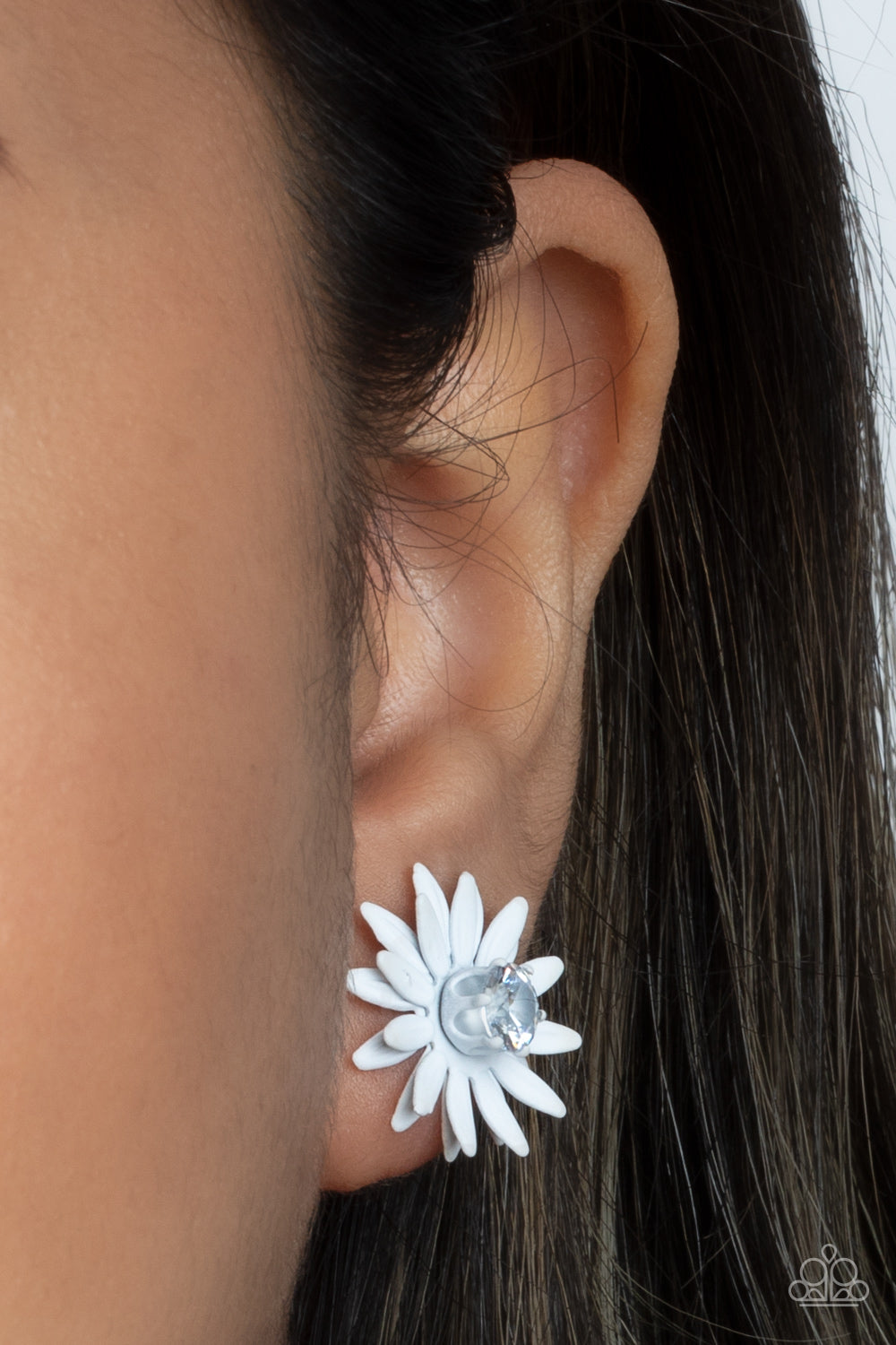 Sunshiny DAIS-y - White Post Earring - Paparazzi Accessories  Layers of white petals fan out from an oversized white rhinestone fitting, blooming into a sparkly floral centerpiece. Earring attaches to a standard post fitting.  All Paparazzi Accessories are lead free and nickel free!  Sold as one pair of post earrings.