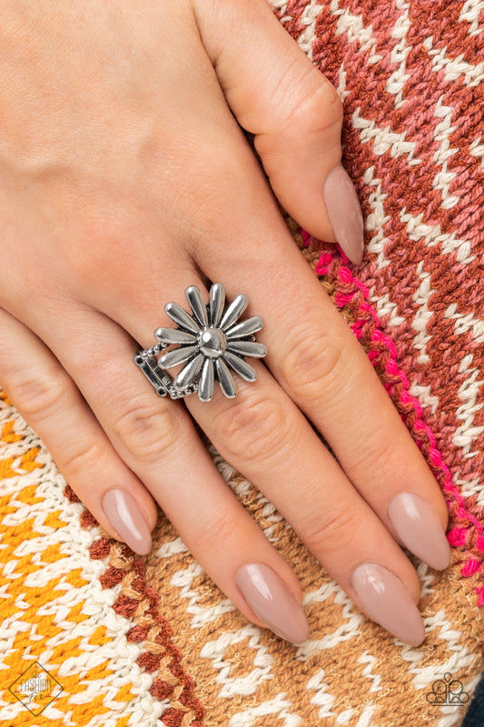 GROWING Steady Silver Ring - Paparazzi Accessories  A splendidly whimsical shiny silver daisy sits atop layered and studded silver bands creating a blossoming centerpiece atop the finger. Features a stretchy band for a flexible fit.  Sold as one individual ring.