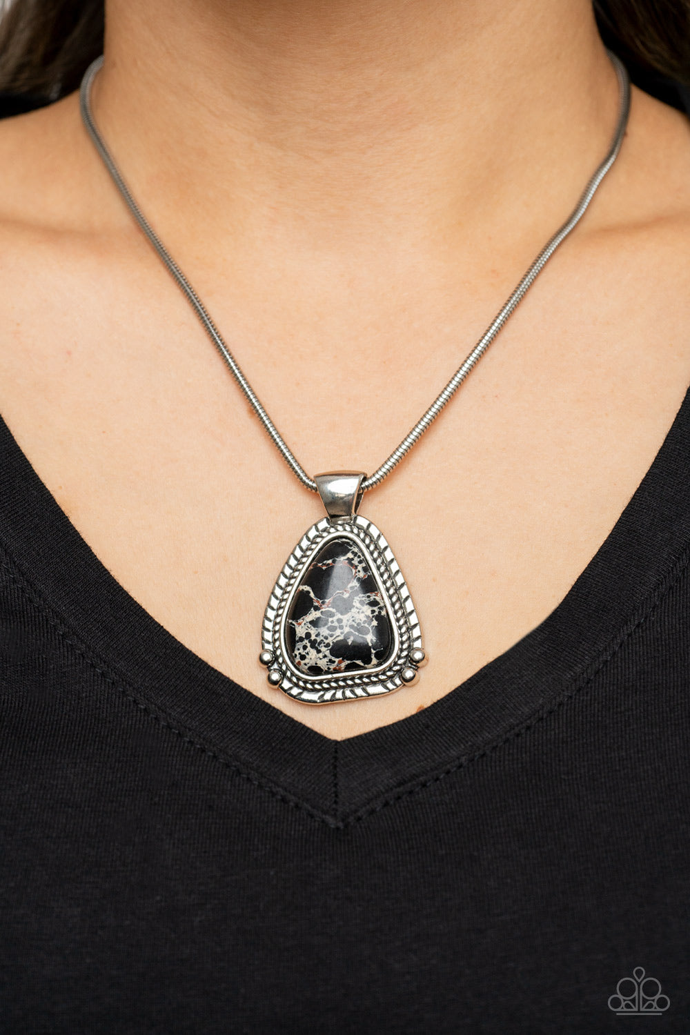Artisan Adventure Black Necklace - Paparazzi Accessories  Featuring a studded and textured silver frame, an asymmetrical black stone pendant glides along a rounded silver snake chain below the collar for an authentically artisan-inspired fashion. Features an adjustable clasp closure.  Sold as one individual necklace. Includes one pair of matching earrings.
