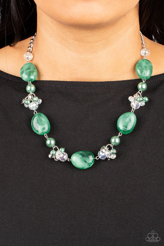 The Top TENACIOUS Green Necklace - Paparazzi Accessories  Featuring a faux stone look, a refreshing collection of cloudy Leprechaun beads join bubbly Leprechaun pearls, and white crystal-like gems below the collar. Dainty clusters of Leprechaun pearls, flat silver beads, and white crystal-like gems adorn the display, adding effervescent movement to the whimsical scene. Features an adjustable clasp closure.  Sold as one individual necklace. Includes one pair of matching earrings.