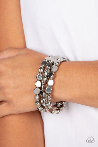 HAUTE Stone Silver Bracelet - Paparazzi Accessories  Featuring irregular stone shapes, a shiny series of silver beads are threaded along stretchy bands around the wrist for a bold pop of monochromatic magic.  Sold as one set of three bracelets.