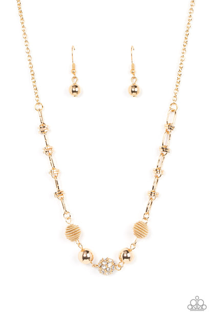Taunting Twinkle Gold Necklace - Paparazzi Accessories  Pairs of gold coiled and smooth gold beads flank a white rhinestone encrusted bead along an oval and gold disc linked chain, creating a glitzy combination below the collar. Features an adjustable clasp closure.  Sold as one individual necklace. Includes one pair of matching earrings.