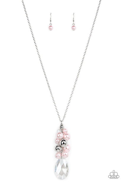 Drip Drop Dazzle Pink Necklace - Paparazzi Accessories  Featuring an iridescent shimmer, a dramatically oversized crystal-like teardrop swings from the bottom of a cluster of shiny silver, pearly white, and crystal-like beads, creating a dazzling pendant at the bottom of a lengthened silver chain. Features an adjustable clasp closure.  Sold as one individual necklace. Includes one pair of matching earrings.
