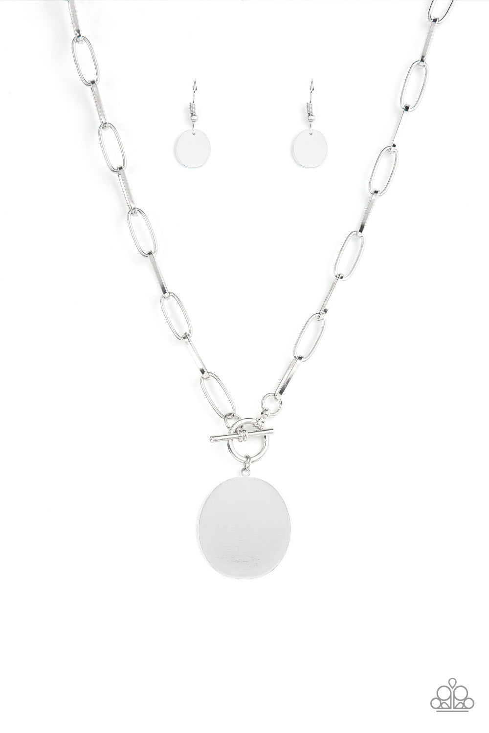 Tag Out Silver Necklace - Paparazzi Accessories  An oversized oval silver disc swings from the bottom of a substantial oval linked silver chain, resulting in a gritty industrial pendant below the collar. Features a toggle closure.  Sold as one individual necklace. Includes one pair of matching earrings.