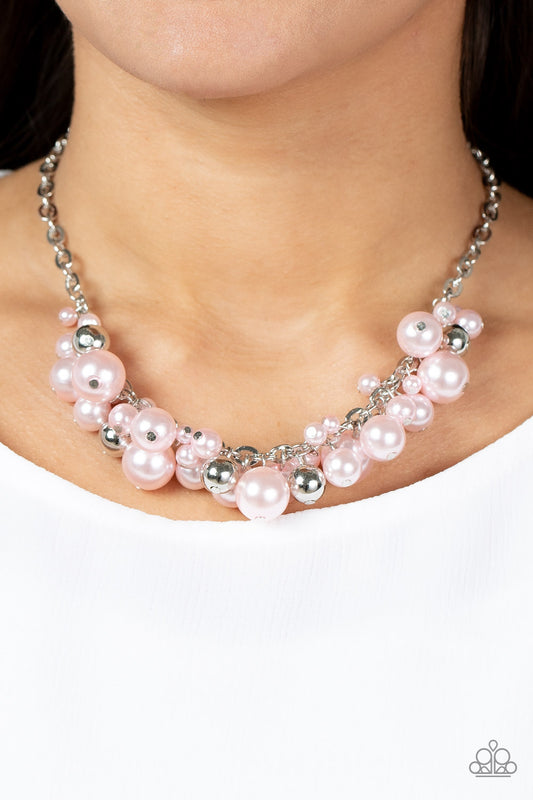 Classical Culture Pink Necklace - Paparazzi Accessories  An effervescent collection of bubbly pink pearls and shiny silver beads delicately cluster along the center of an ornate silver chain, creating a classic fringe below the collar. Features an adjustable clasp closure.  Sold as one individual necklace. Includes one pair of matching earrings.