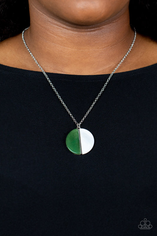 Elegantly Eclipsed Green Necklace - Paparazzi Accessories  A pair of jade stone and white shell-like half moon frames adorn the front of a round silver fitting, creating a whimsical pendant below the collar. Features an adjustable clasp closure.  Sold as one individual necklace. Includes one pair of matching earrings.