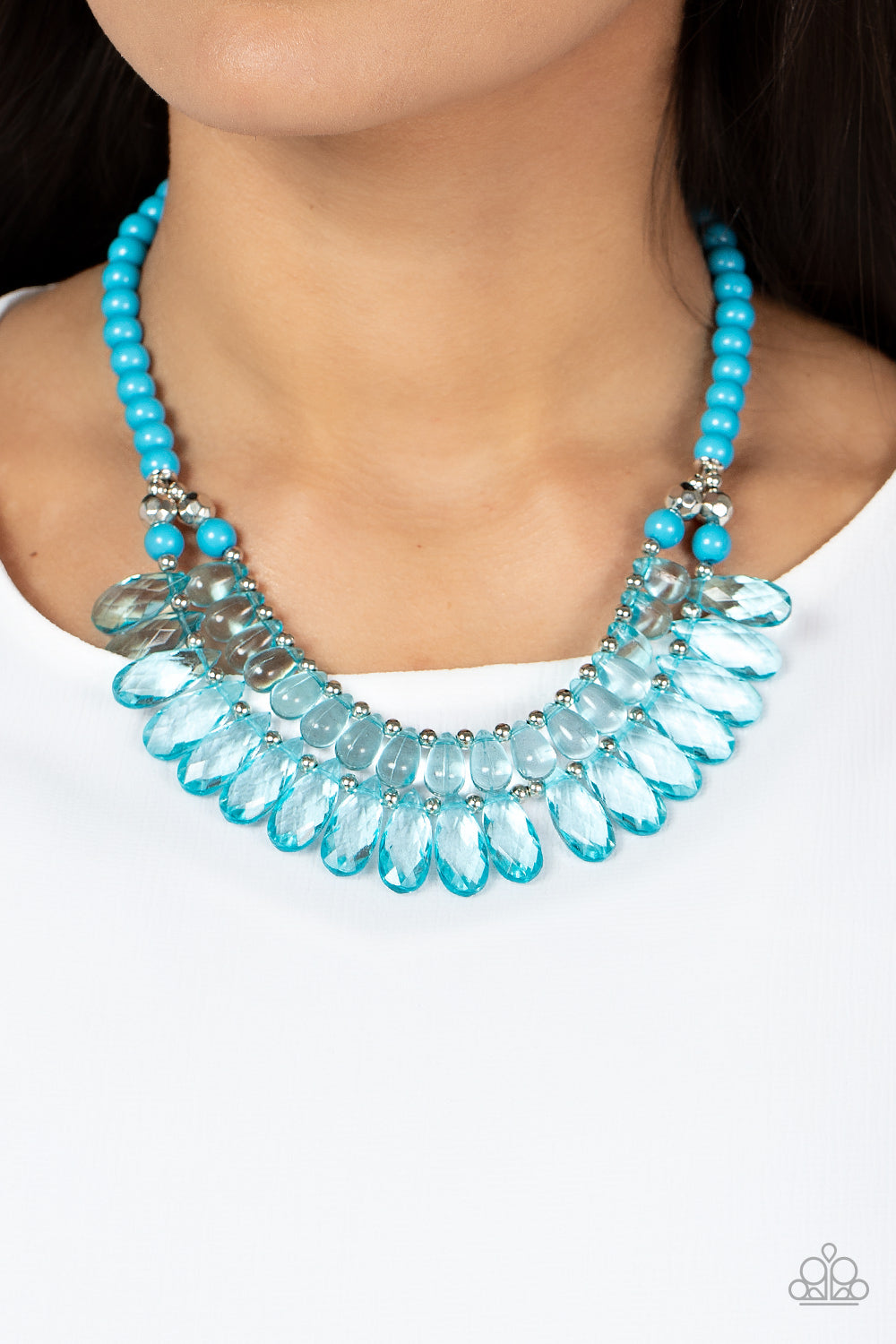 All Across the GLOBETROTTER Blue Necklace - Paparazzi Accessories  Varying in size, a glassy collection of blue teardrops alternate with dainty silver beads in two rows below the collar for a glamorous pop of color. Features an adjustable clasp closure.  Sold as one individual necklace. Includes one pair of matching earrings.