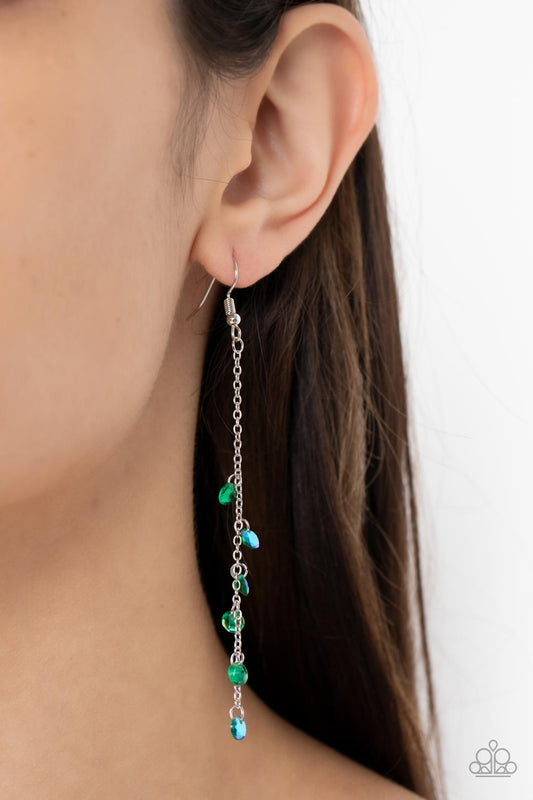 Extended Eloquence Green Earring - Paparazzi Accessories  Featuring stellar iridescence, a dainty collection of glassy green rhinestones tumble down a lengthened silver chain for a twinkly tasseled look. Earring attaches to a standard fishhook fitting.  Sold as one pair of earrings.