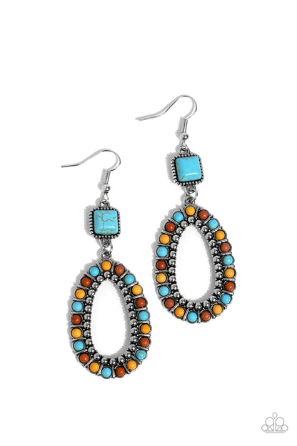 Napa Valley Luxe Multi Earring- Paparazzi Accessories   A turquoise stone, chiseled into a polished square, gives way to a silver studded hoop bordered in dainty turquoise, brown, and yellow stones, creating a rustically scalloped lure. Earring attaches to a standard fishhook fitting.  Sold as one pair of earrings.