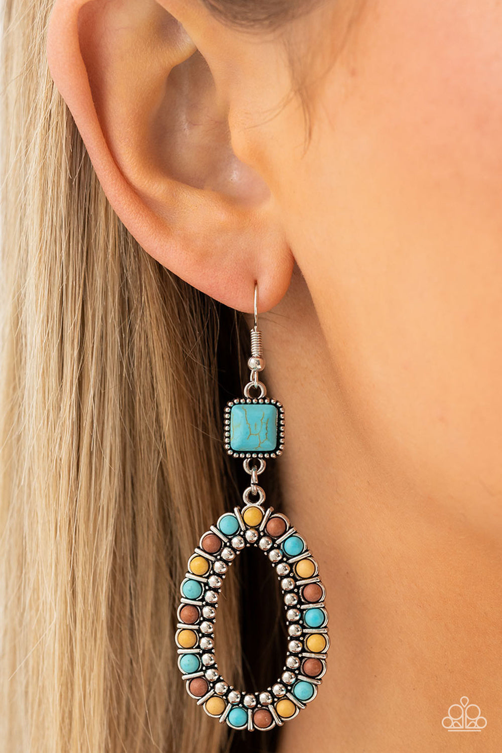 Napa Valley Luxe Multi Earring- Paparazzi Accessories   A turquoise stone, chiseled into a polished square, gives way to a silver studded hoop bordered in dainty turquoise, brown, and yellow stones, creating a rustically scalloped lure. Earring attaches to a standard fishhook fitting.  Sold as one pair of earrings.