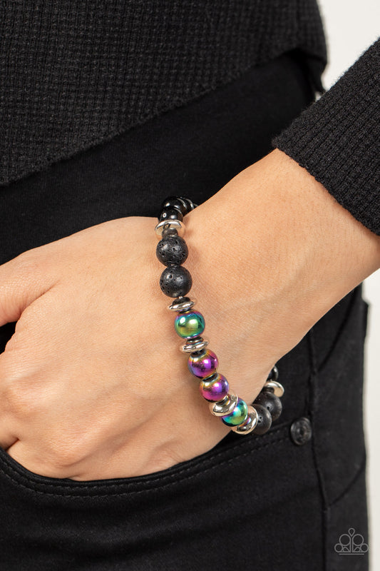 Mega Metamorphic Multi Bracelet - Paparazzi Accessories  Infused with a section of polished black beads, a stellar assortment of oil spill beads, silver accents, and black lava rock beads are threaded along stretchy bands around the wrist for an urban flair.  Sold as one individual bracelet.