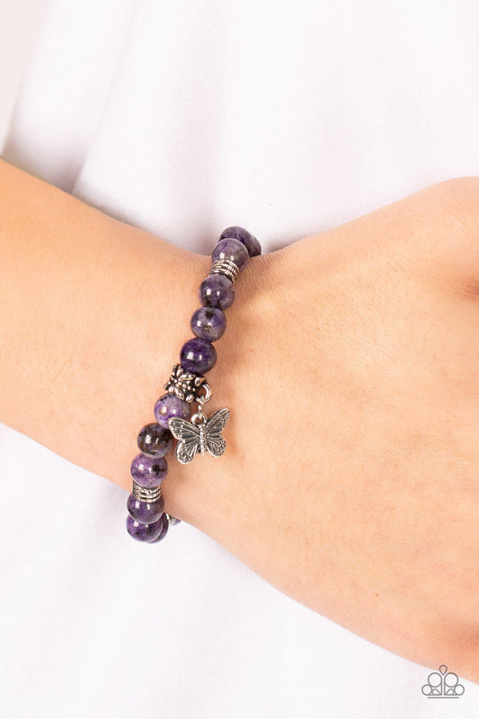 Butterfly Nirvana Purple Bracelet - Paparazzi Accessories  Infused with a silver butterfly charm, textured silver accents and amethyst stone beads are threaded along stretchy bands around the wrist for a whimsical look.  Sold as one individual bracelet.