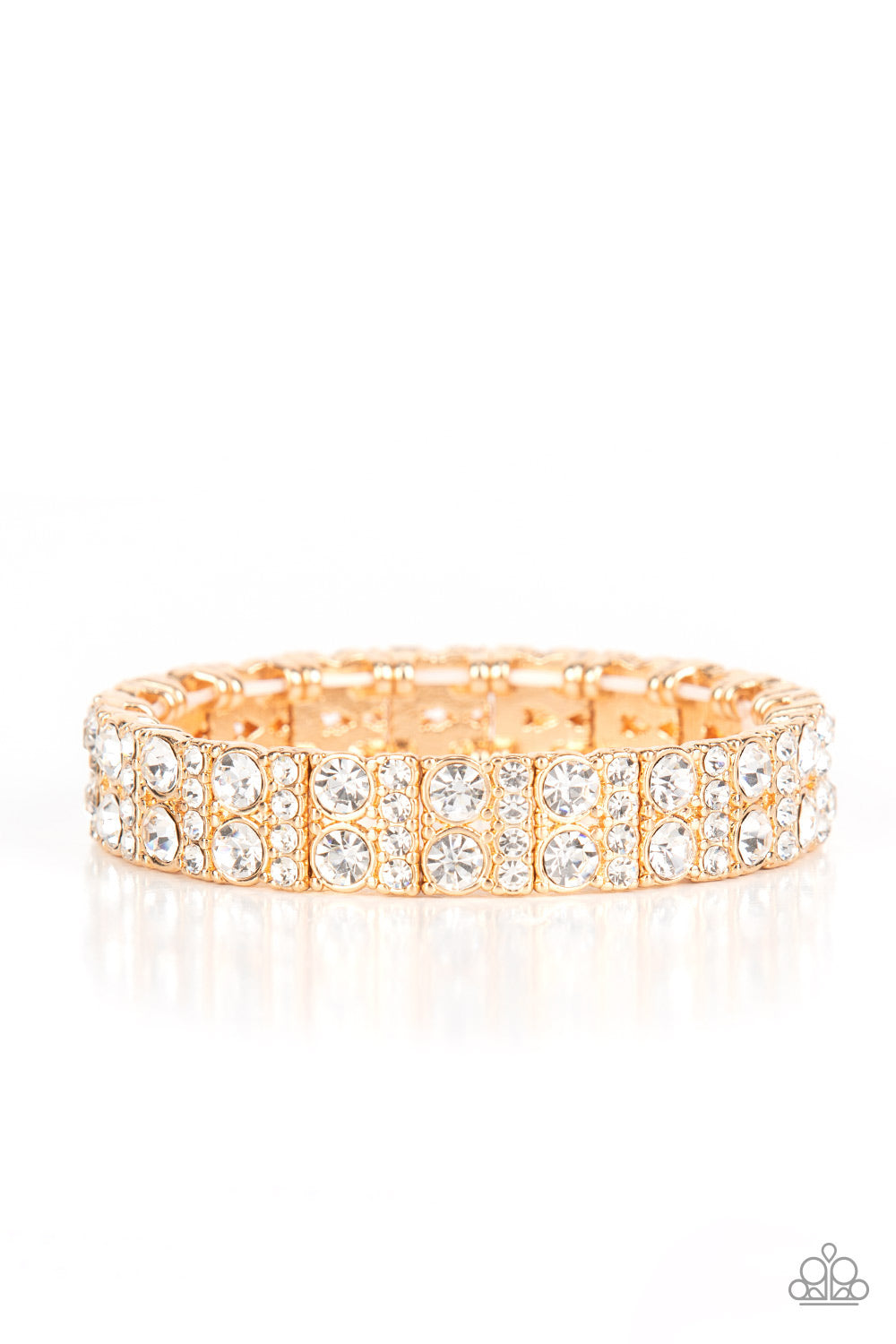 Mic Dropping Drama Gold Bracelet - Paparazzi Accessories  Pairs of glassy white rhinestones and stacked rows of glitzy white rhinestones join into studded gold frames along a stretchy band around the wrist, creating a glamorous centerpiece.  Sold as one individual bracelet.