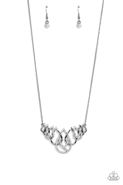 Thunderstruck Teardrops Black Necklace - Paparazzi Accessories  Gradually increasing in size, glistening gunmetal and white rhinestone encrusted gunmetal teardrops ornately interlock below the collar for a glamorous fashion. Features an adjustable clasp closure.  Sold as one individual necklace. Includes one pair of matching earrings.