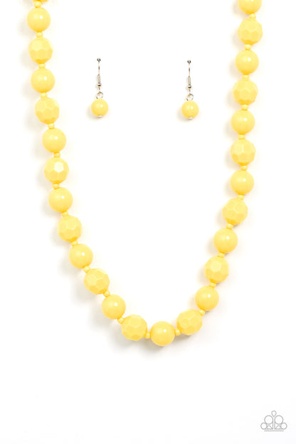 Popping Promenade Yellow Necklace - Paparazzi Accessories  Infused with dainty yellow beads, a bubbly collection of smooth and faceted yellow beads alternate along an invisible wire below the collar for a sunny pop of color. Features an adjustable clasp closure.  Sold as one individual necklace. Includes one pair of matching earrings.