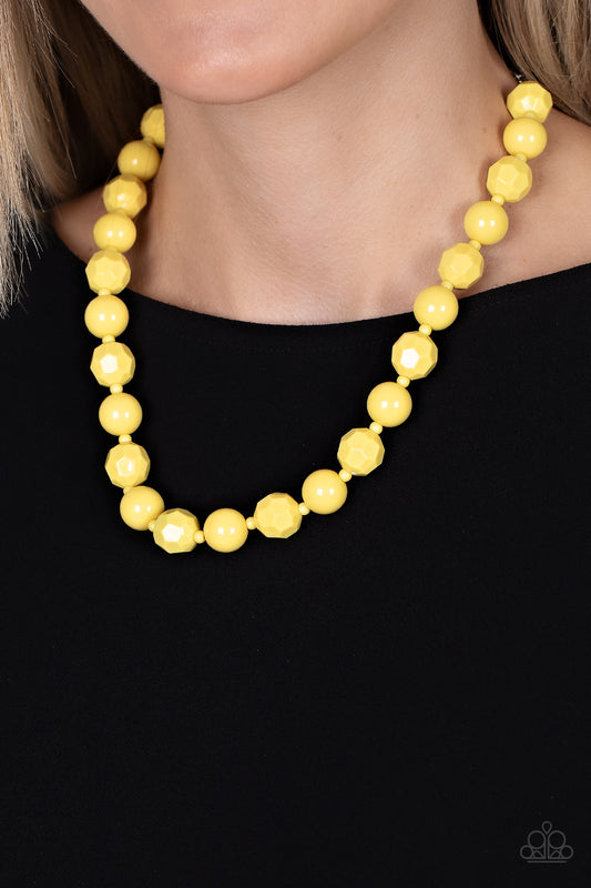 Popping Promenade Yellow Necklace - Paparazzi Accessories  Infused with dainty yellow beads, a bubbly collection of smooth and faceted yellow beads alternate along an invisible wire below the collar for a sunny pop of color. Features an adjustable clasp closure.  Sold as one individual necklace. Includes one pair of matching earrings.