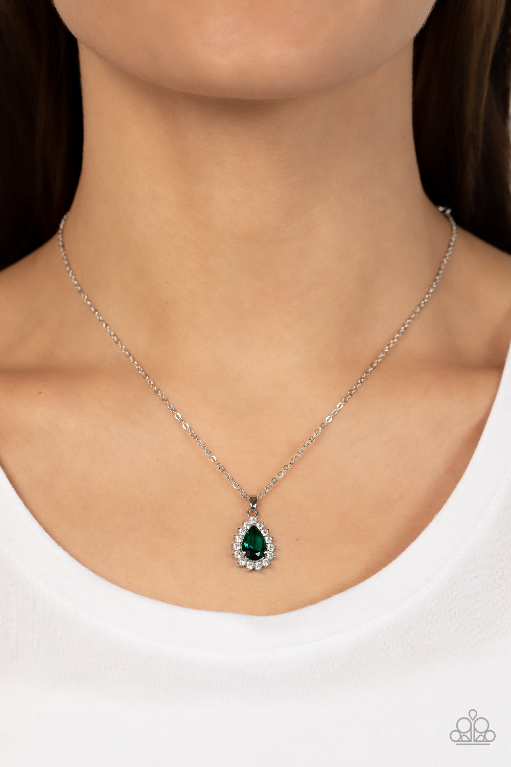 A Guiding SOCIALITE Green Necklace - Paparazzi Accessories   A glassy green teardrop is bordered in sparkly white rhinestones, creating a timelessly dainty pendant below the collar. Features an adjustable clasp closure.  Sold as one individual necklace. Includes one pair of matching earrings.