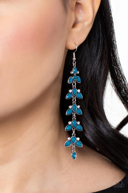 Fanciful Foliage Blue Earring - Paparazzi Accessories  Infused with pairs of dainty white rhinestones, faceted Mykonos Blue teardrop beads delicately connect into leafy frames that link into an extended lure for an elegant finish. Earring attaches to a standard fishhook fitting.  Sold as one pair of earrings.