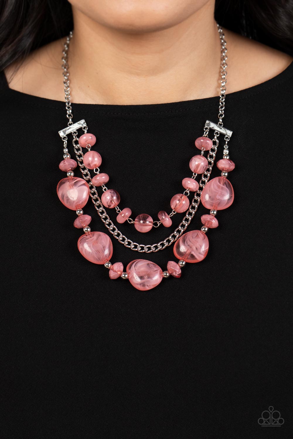 Oceanside Service Pink Necklace - Paparazzi Accessories  A single silver chain separates two mismatched rows of oversized and cloudy glass-like pink beads. The colorful rows are held in place with textured silver fittings, creating an ethereal pop of color below the collar. Features an adjustable clasp closure.  Sold as one individual necklace. Includes one pair of matching earrings.