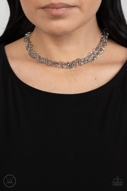 Cause a Commotion Silver Choker Necklace - Paparazzi Accessories  A shiny series of flat and beveled silver hoops delicately cluster along a dainty silver chain around the neck, creating a tinkling fringe. Features an adjustable clasp closure.  Sold as one individual choker necklace. Includes one pair of matching earrings.