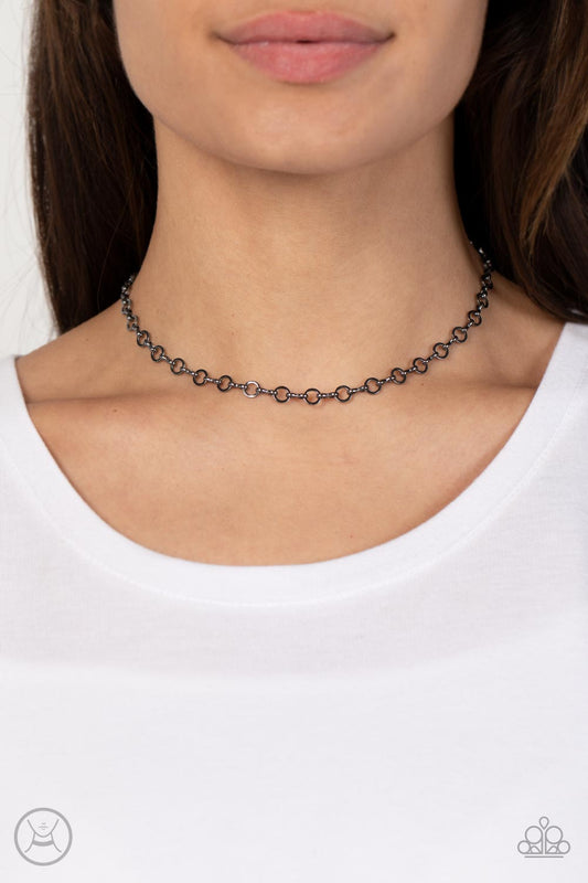 Keepin it Chic Black Choker Necklace - Paparazzi Accessories  Dainty gunmetal rings alternate with pinched gunmetal links around the neck, creating a chic minimalist inspired look. Features an adjustable clasp closure.  Sold as one individual choker necklace. Includes one pair of matching earrings.