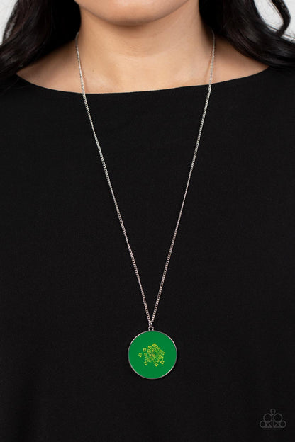 Prairie Picnic - Green Item #P2SE-GRXX-235XX Encased in a glassy fitting, a dainty bouquet of firework flowers blooms across a Leprechaun backdrop, resulting in a colorful floral pendant at the bottom of an extended silver chain. Features an adjustable clasp closure.  Sold as one individual necklace. Includes one pair of matching earrings.