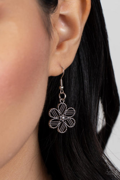 Basketful of Blossoms Silver Necklace - Paparazzi Accessories  Featuring metallic wicker-like patterns, stacks of teardrop and heart shaped filigree-filled silver petals delicately link into a decorative row of flowers. The floral frames gradually increase in size as they move towards the center, creating a vintage inspired display below the collar. Features an adjustable clasp closure.  Sold as one individual necklace. Includes one pair of matching earrings.