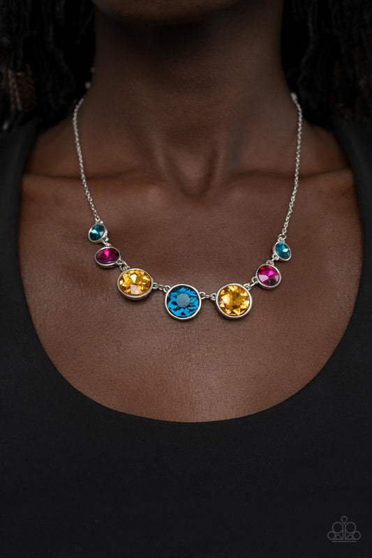 Pampered Powerhouse Multi Necklace - Paparazzi Accessories  Encased in shiny silver frames, a glitzy collection of blue, yellow, and pink rhinestones gradually increase in size as they link below the collar for a flawless finish. Features an adjustable clasp closure.  Sold as one individual necklace. Includes one pair of matching earrings.