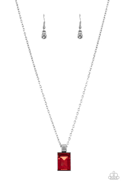 Understated Dazzle Red Necklace - Paparazzi Accessories  Featuring a white rhinestone encrusted silver fitting, an oversized emerald cut red rhinestone swings from the bottom of a dainty silver chain below the collar for a glamorous fashion. Features an adjustable clasp closure.  Sold as one individual necklace. Includes one pair of matching earrings.