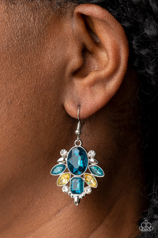 Glitzy Go-Getter Multi Earring - Paparazzi Accessories  A brilliant blue gem makes a sparkling centerpiece amidst a glitzy fringe of marquise, round, and emerald cut blue, yellow, and white rhinestones resulting in a timeless lure. Earring attaches to a standard fishhook fitting.  Sold as one pair of earrings.