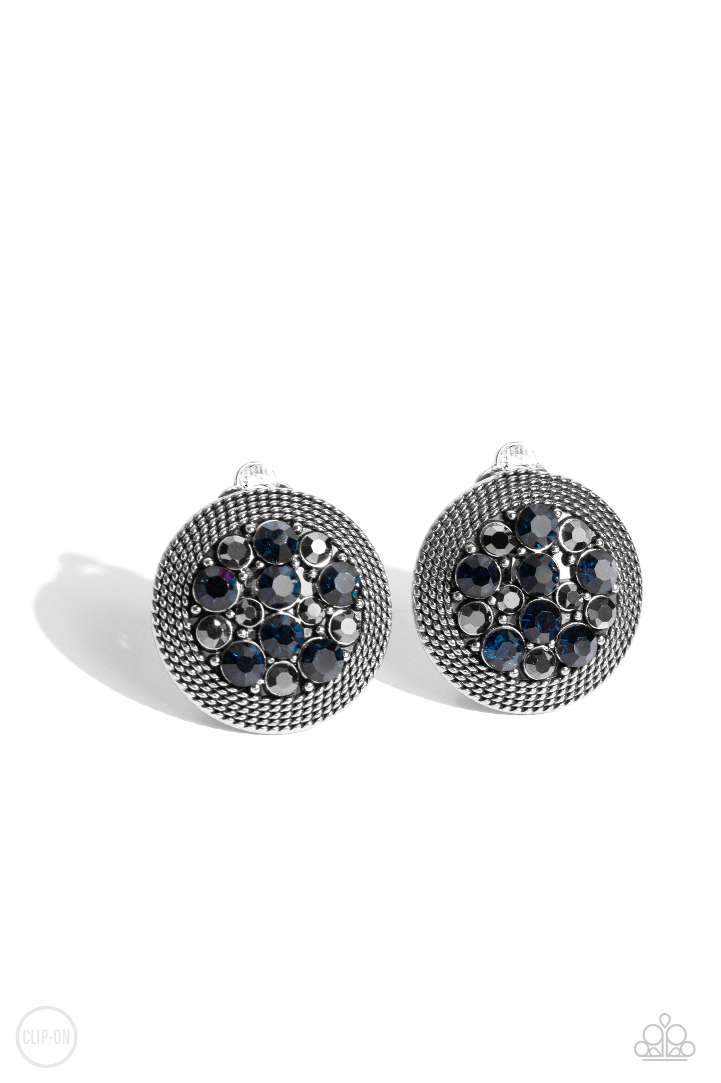 Stellar Status Blue Clip-On Earring - Paparazzi Accessories  A glitzy collection of blue and hematite rhinestones are encircled with a silver rope-like border, resulting in a smoldering centerpiece. Earring attaches to a standard clip-on earrings.  Sold as one pair of clip-on earrings.  New KitClip On Earring Sku:  P5CO-BLXX-055XX