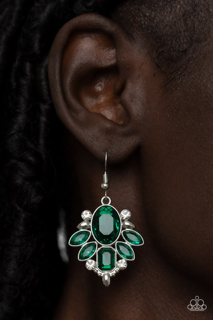 Glitzy Go-Getter Green Earring - Paparazzi Accessories  A regal green gem makes a sparkling centerpiece amidst a glitzy fringe of marquise and emerald cut green rhinestones resulting in a timeless lure. Earring attaches to a standard fishhook fitting.  Sold as one pair of earrings.