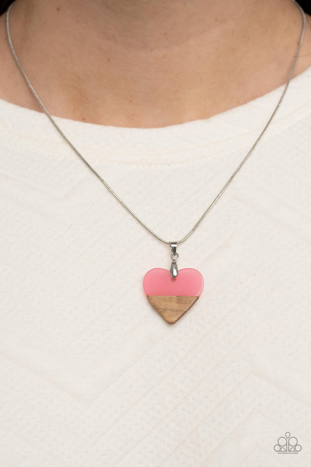 You Complete Me Pink Necklace - Paparazzi Accessories  The tip of a pink acrylic heart attaches to a wooden accent, resulting in a colorfully free-spirited pendant below the collar. Features an adjustable clasp closure.  Sold as one individual necklace. Includes one pair of matching earrings.