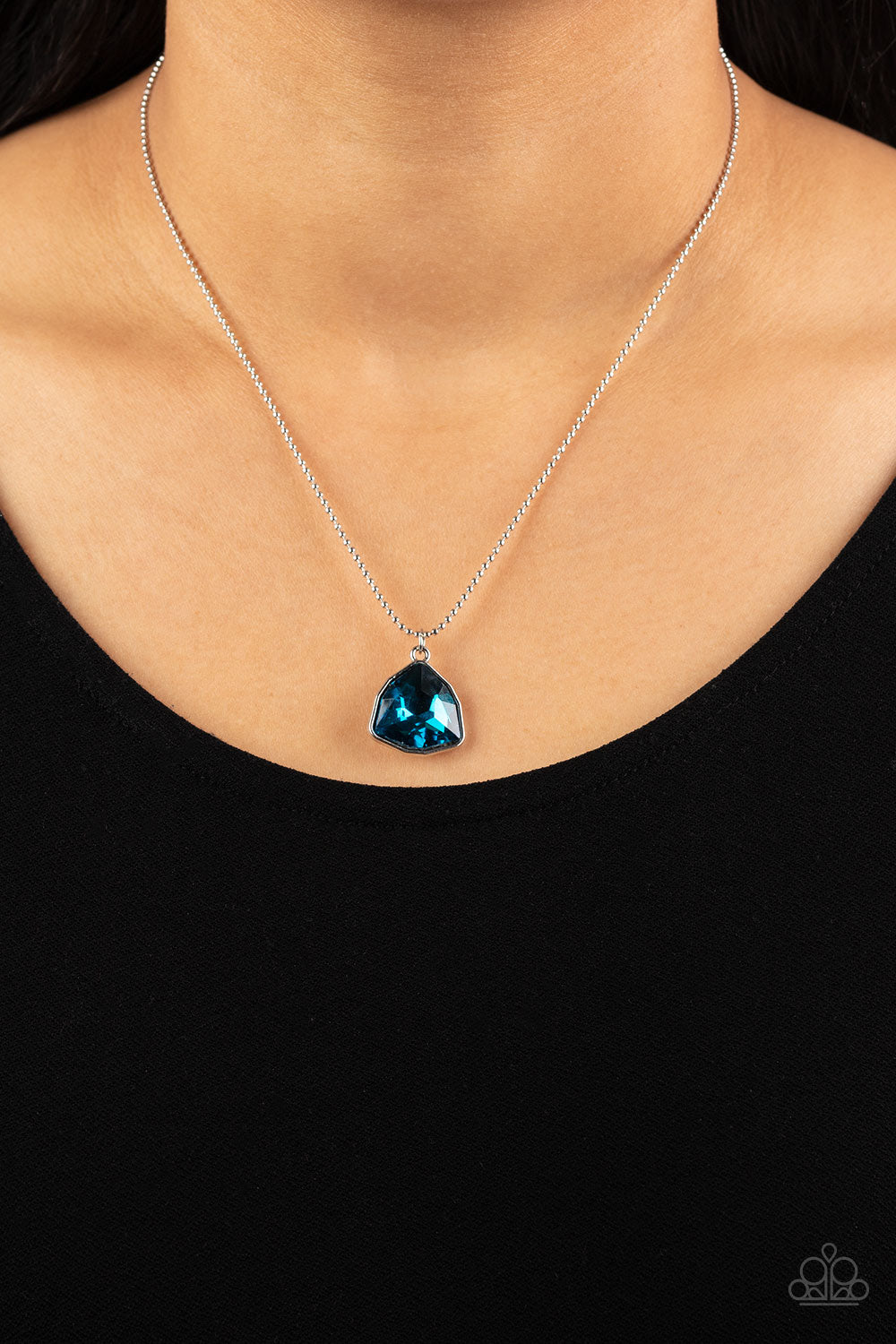 Galactic Duchess Blue Necklace - Paparazzi Accessories  A faceted asymmetrical blue gem is encased in a sleek silver frame at the bottom of a silver popcorn chain, creating a stellar pendant below the collar. Features an adjustable clasp closure.  Sold as one individual necklace. Includes one pair of matching earrings.