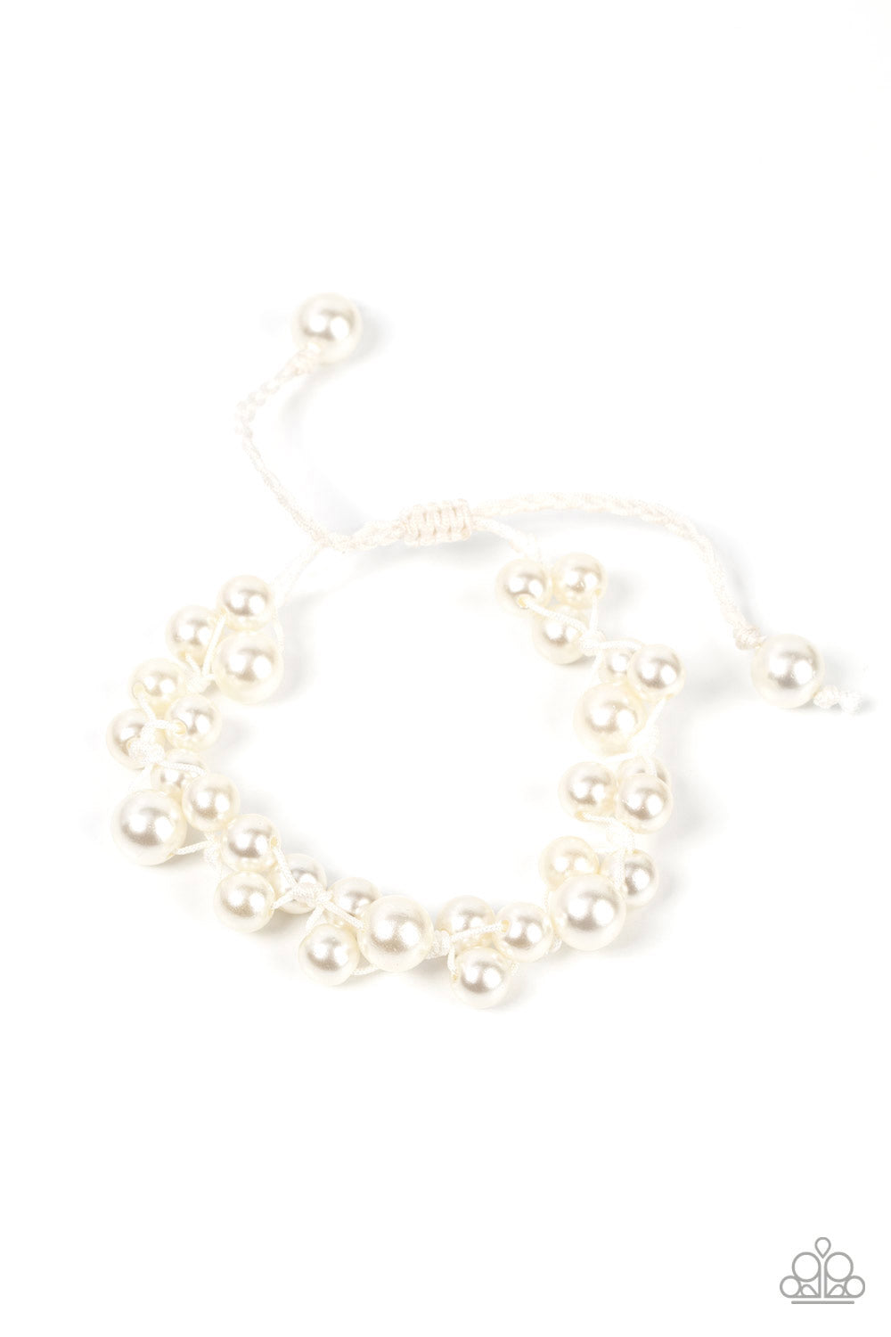Vintage Versatility - White Item #P9WH-WTXX-230XX Bubbly clusters of white pearls are decoratively knotted around the wrist, adding a timeless twist to the elegant centerpiece. Features an adjustable sliding knot closure.  Sold as one individual bracelet.