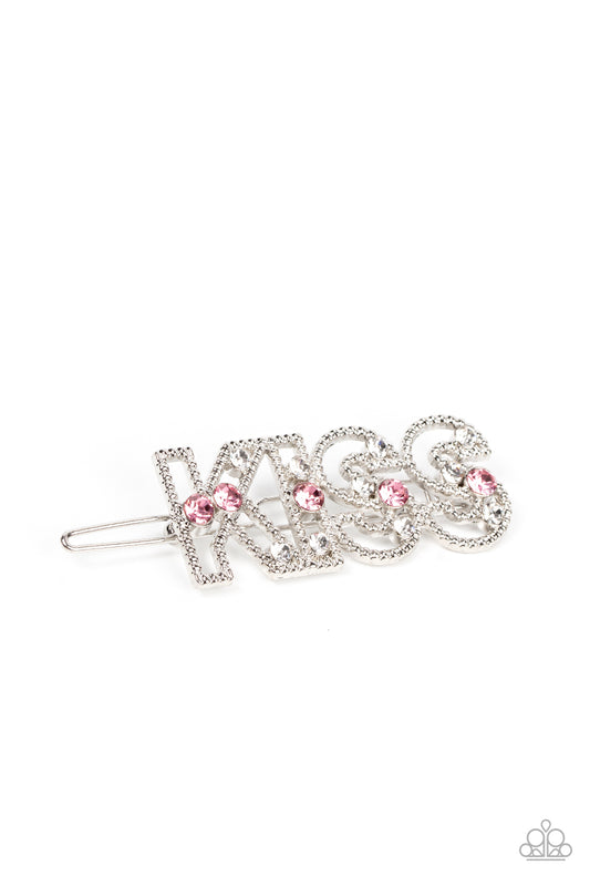 Kiss Bliss Pink Hair Clip - Paparazzi Accessories  Glassy white and sparkly pink rhinestones are sprinkled across the front of airy silver frames that spell out, "Kiss" for a flirtatious finish. Features a clamp barrette closure.  Sold as one individual barrette.